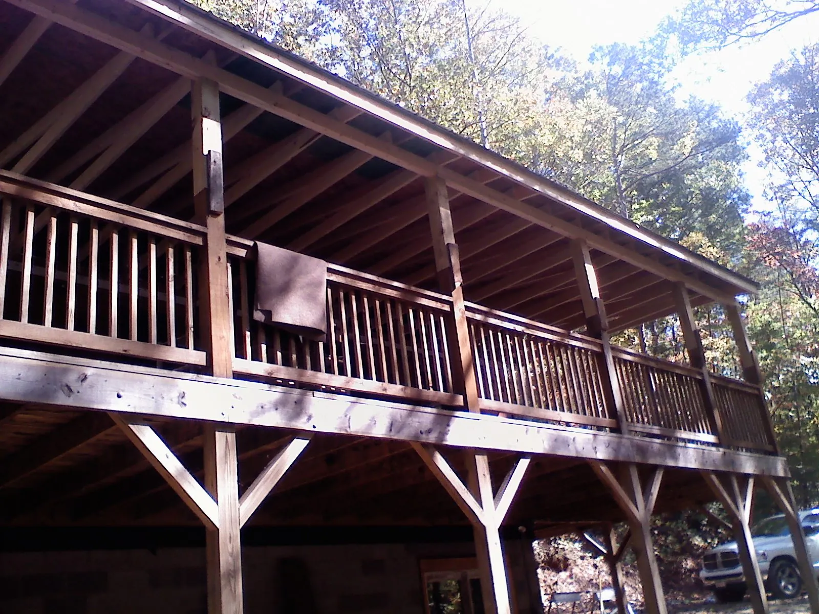 Timber framing under a new elevated porch and deck — Roof Leak Repair in Navasota by Roofing Brothers